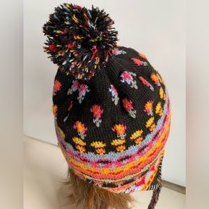 Festival Knit Hat with pom pom. Side Ties. Pink Yellow Black Floral pattern.